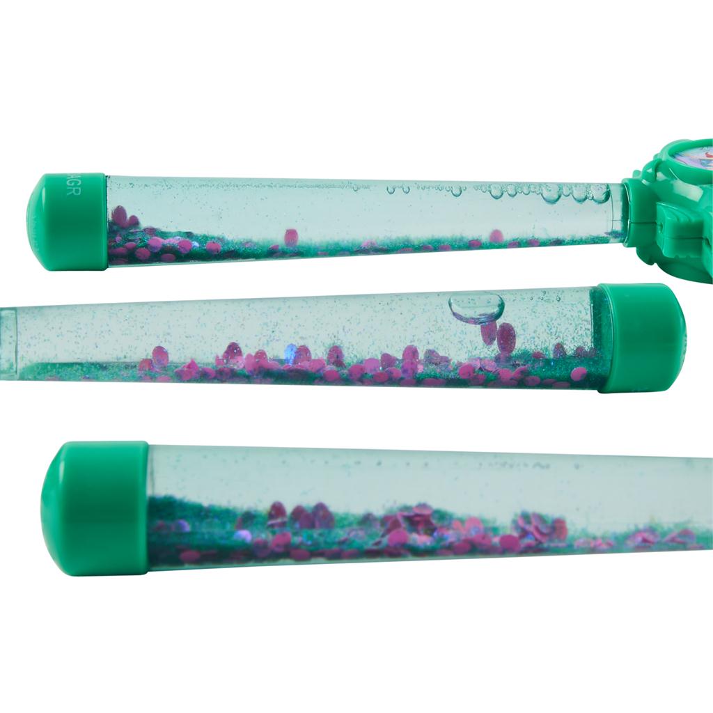 Three transparent tubes with green lids filled with colorful sand and water.
