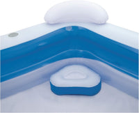 Close up of a blue and white inflatable pool's inner seat and headrest with cupholder.